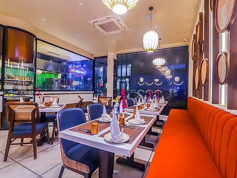 The Indian Grill Multi-Cuisine Dining at Godwin Hotels — warm atmosphere and gourmet fare